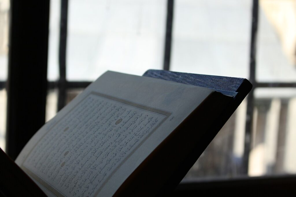 Forgetting the Quran – an open mushaf by a window